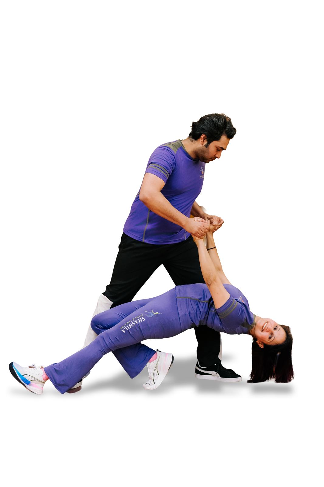 Two SHEEDance dancers in purple studio clothing